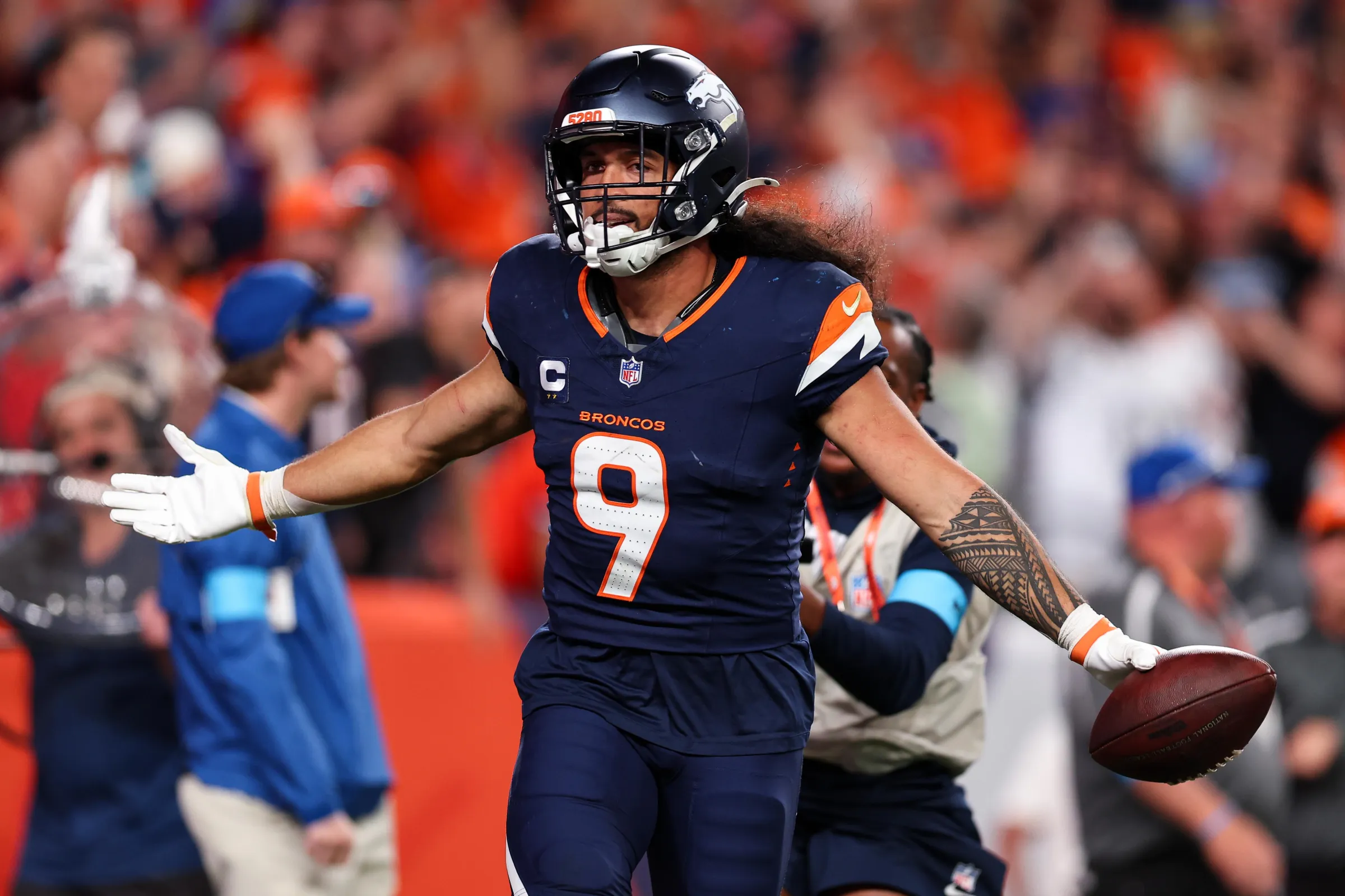 DENVER, COLORADO - SEPTEMBER 27: Talanoa Hufanga #9 of the Denver Broncos celebrates after intercepting a pass to win the game against the Los Angeles Rams at Empower Field at Mile High on September 27, 2026 in Denver, Colorado. (Photo by Brooke Sutton/Getty Images)