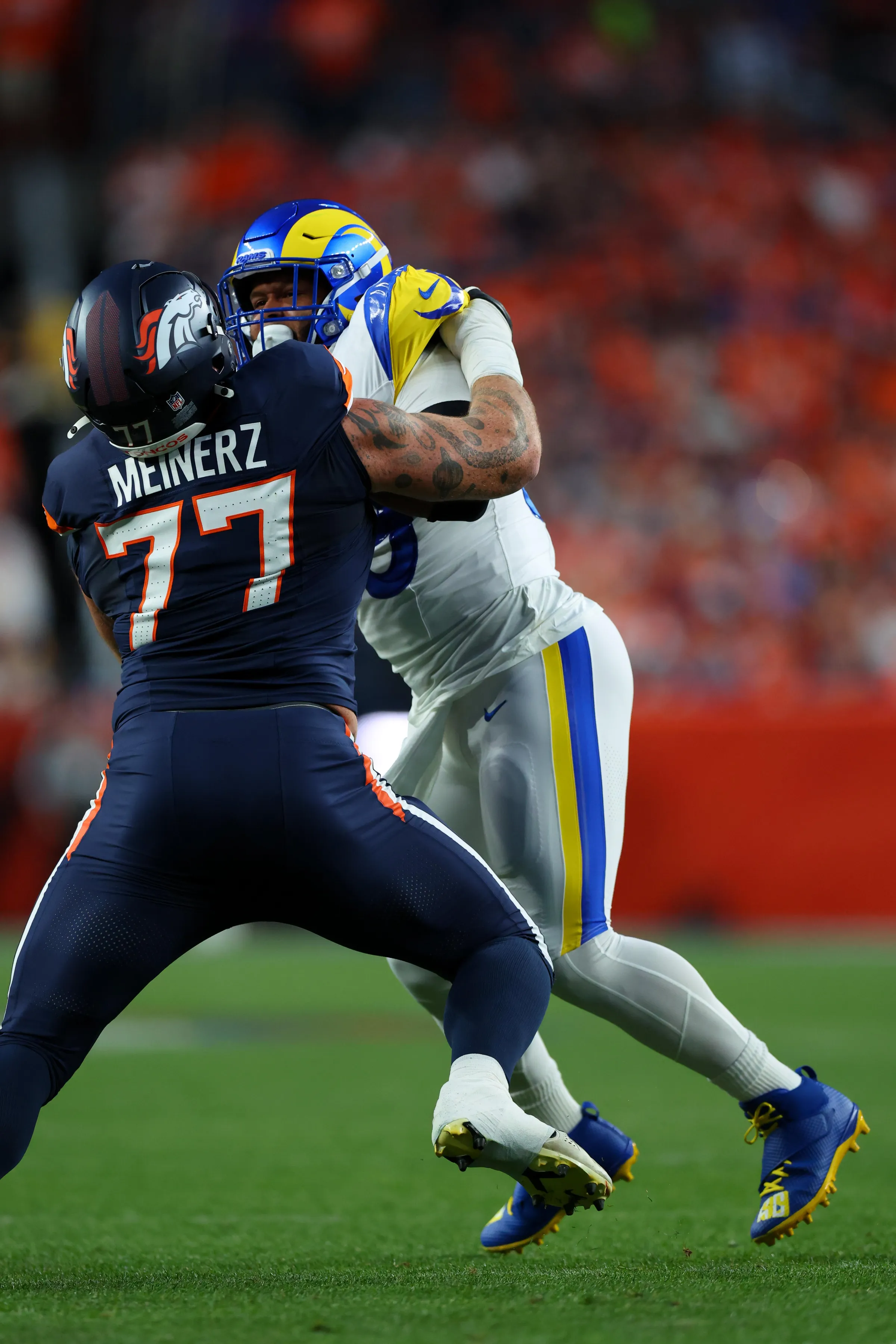 DENVER, CO - SEPTEMBER 27: Aaron Donald #99 of the Los Angeles Rams rushes against Quinn Meinerz #77 of the Denver Broncos during the first quarter at Empower Field at Mile High on September 27, 2026 in Denver, Colorado. (Photo by Justin Edmonds/Getty Images)