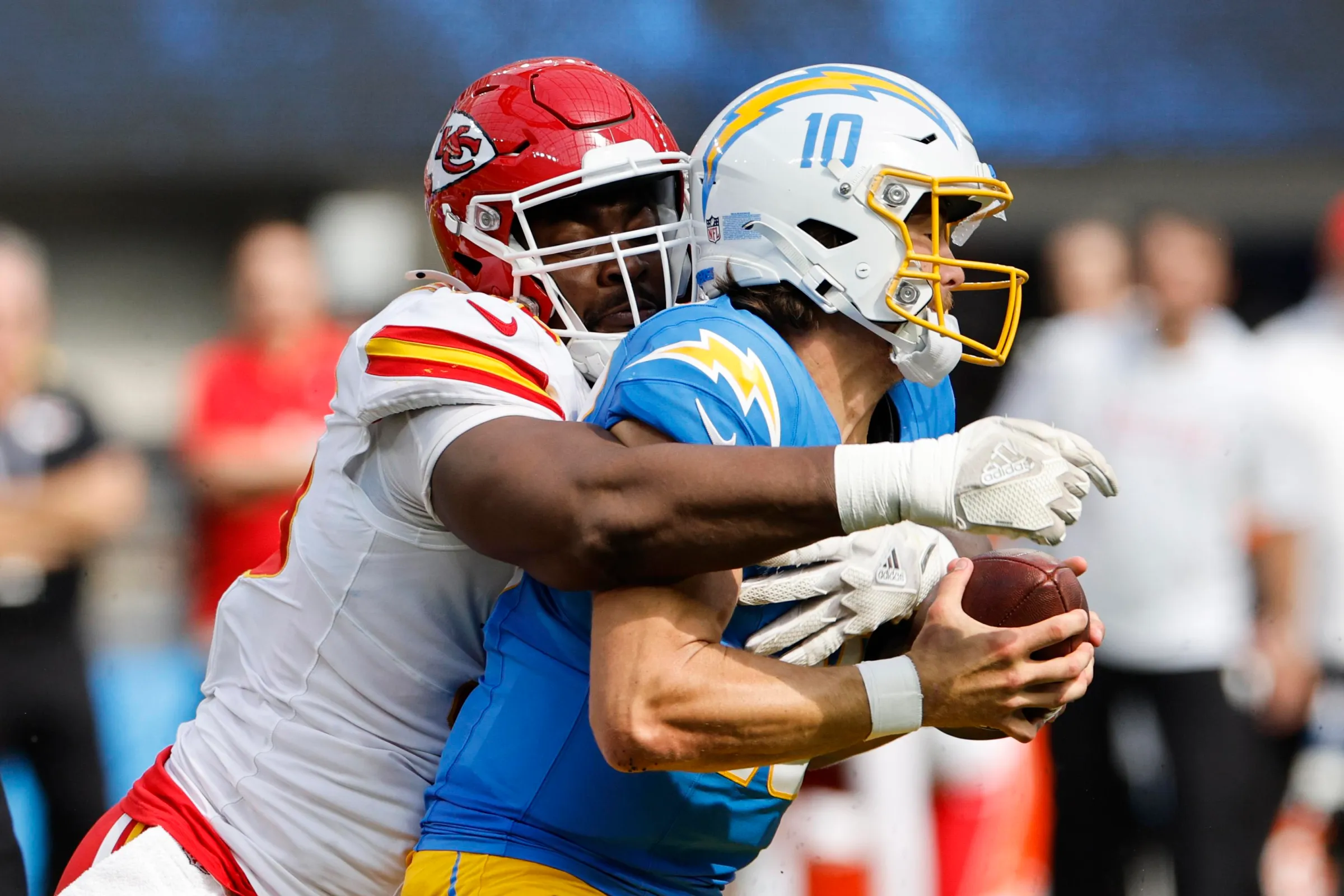 INGLEWOOD, CALIFORNIA - SEPTEMBER 29: Justin Herbert #10 of the Los Angeles Chargers is sacked by Chris Jones #95 of the Kansas City Chiefs in the second quarter at SoFi Stadium on September 29, 2024 in Inglewood, California. (Photo by Kevork Djansezian/Getty Images)