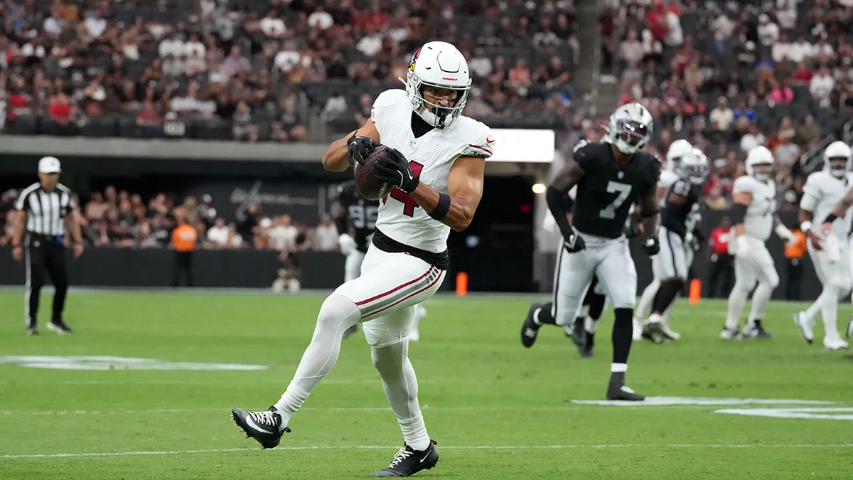 Arizona Cardinals wide receiver Michael Wilson (14) carries the ball against the Las Vegas Raiders in the first half at Allegiant Stadium.