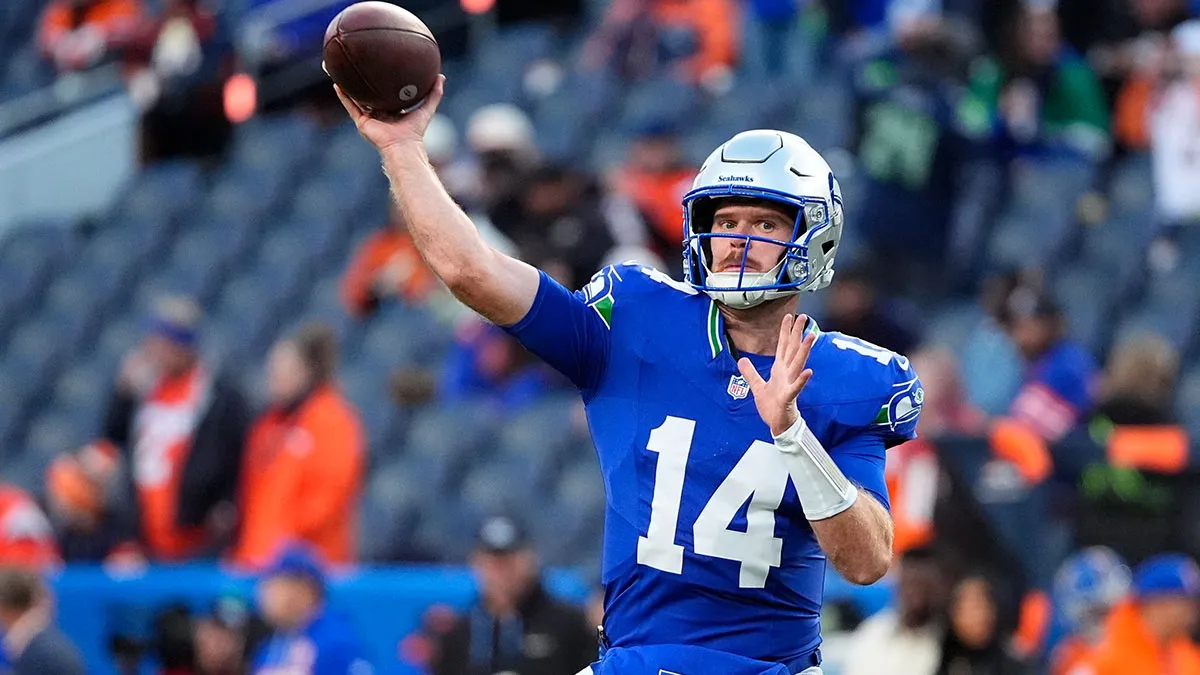 Seattle Seahawks quarterback Sam Darnold (14) warms up before the game against the Denver Broncos at Empower Field at Mile High.