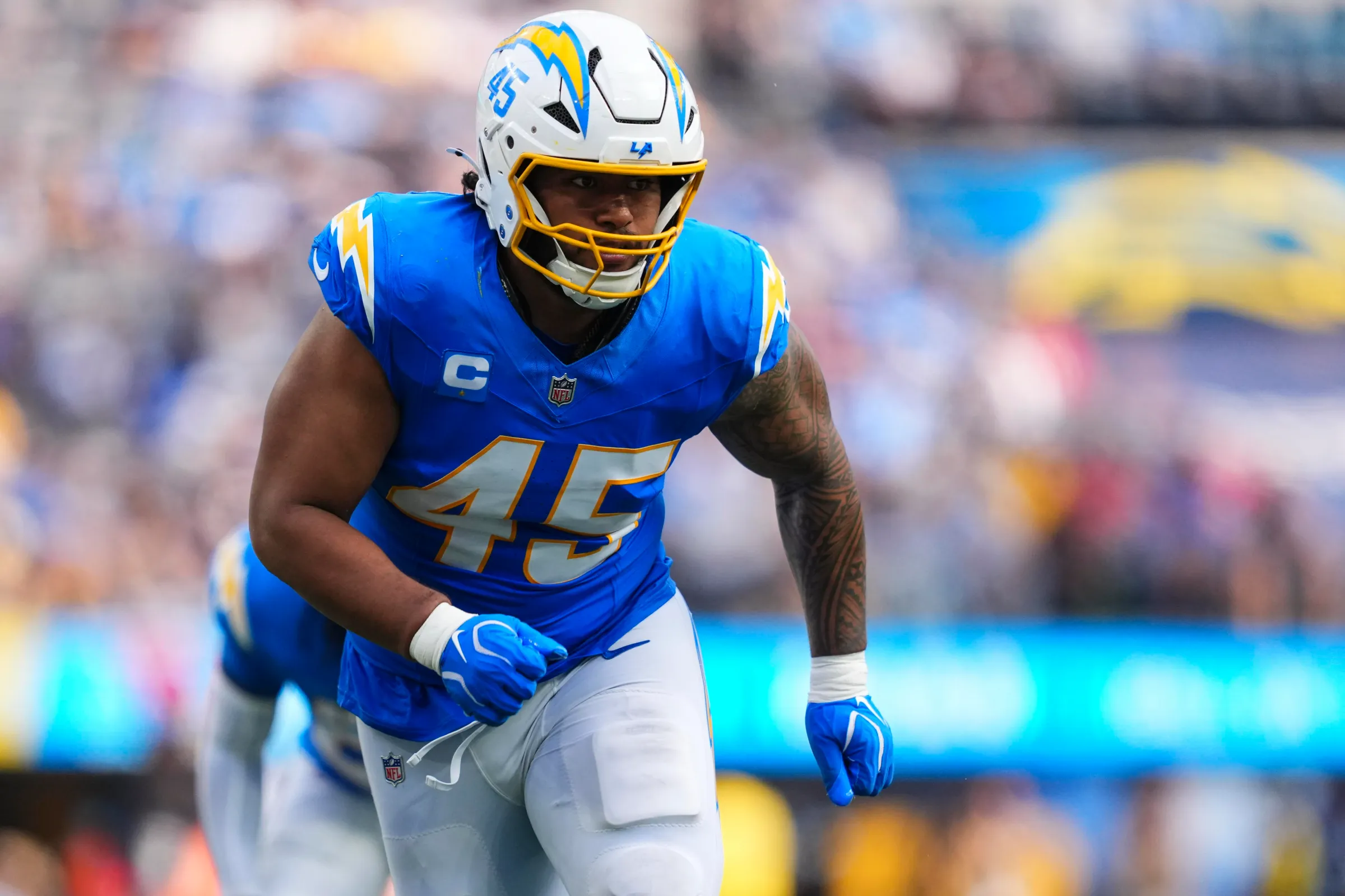 INGLEWOOD, CA - SEPTEMBER 13: Tuli Tuipulotu #45 of the Los Angeles Chargers rushes the passer during an NFL football game against the Arizona Cardinals at SoFi Stadium on September 13, 2026 in Inglewood, California. (Photo by Cooper Neill/Getty Images)