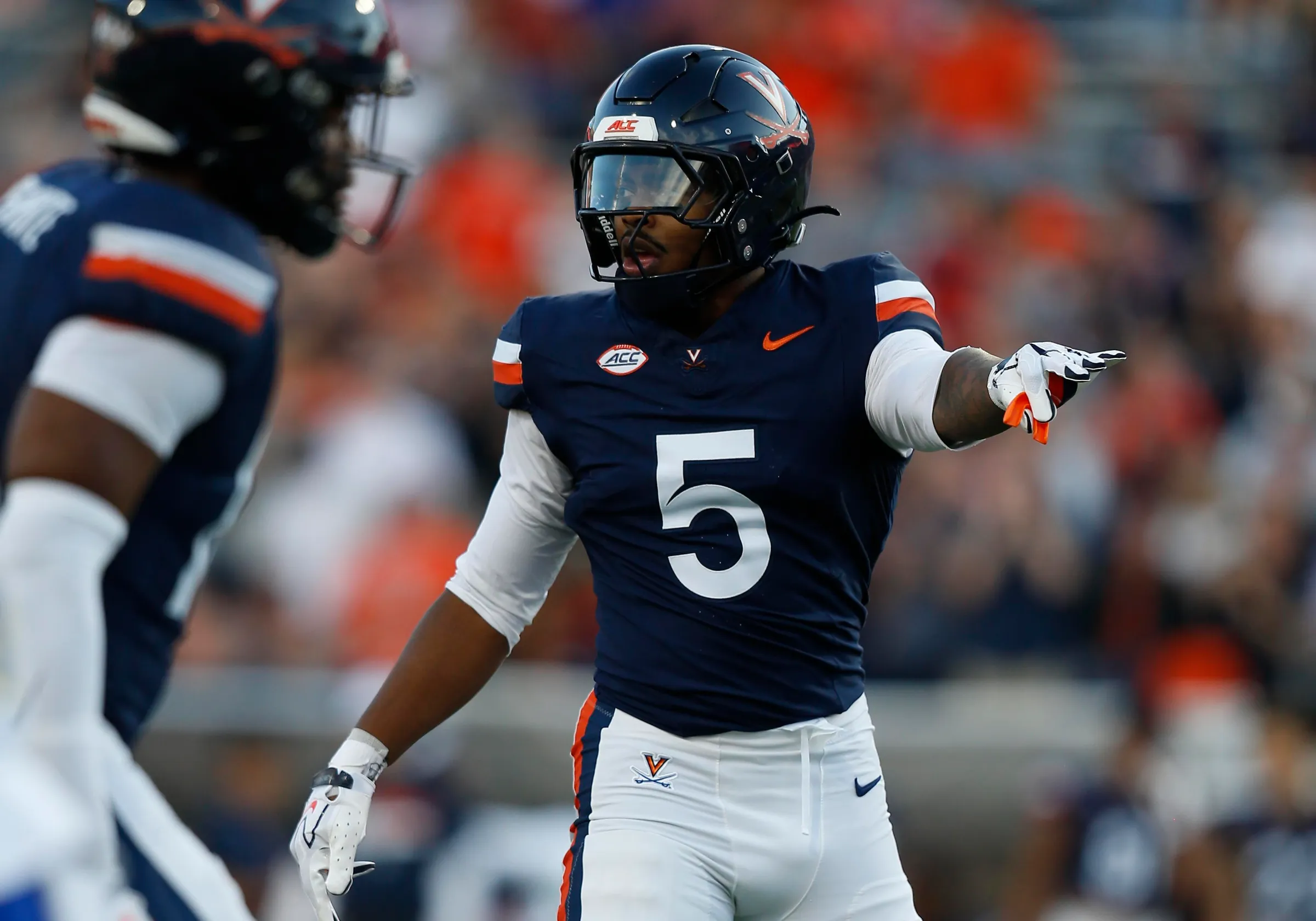 CHARLOTTESVILLE, VA - SEPTEMBER 26: Virginia Cavaliers linebacker Kam Robinson (5) gestures during a college football game between the Delaware Fightin' Blue Hens and the Virginia Cavaliers on September 26, 2026, at Scott Stadium in Charlottesville, VA. (Photo by Lee Coleman/Icon Sportswire via Getty Images)