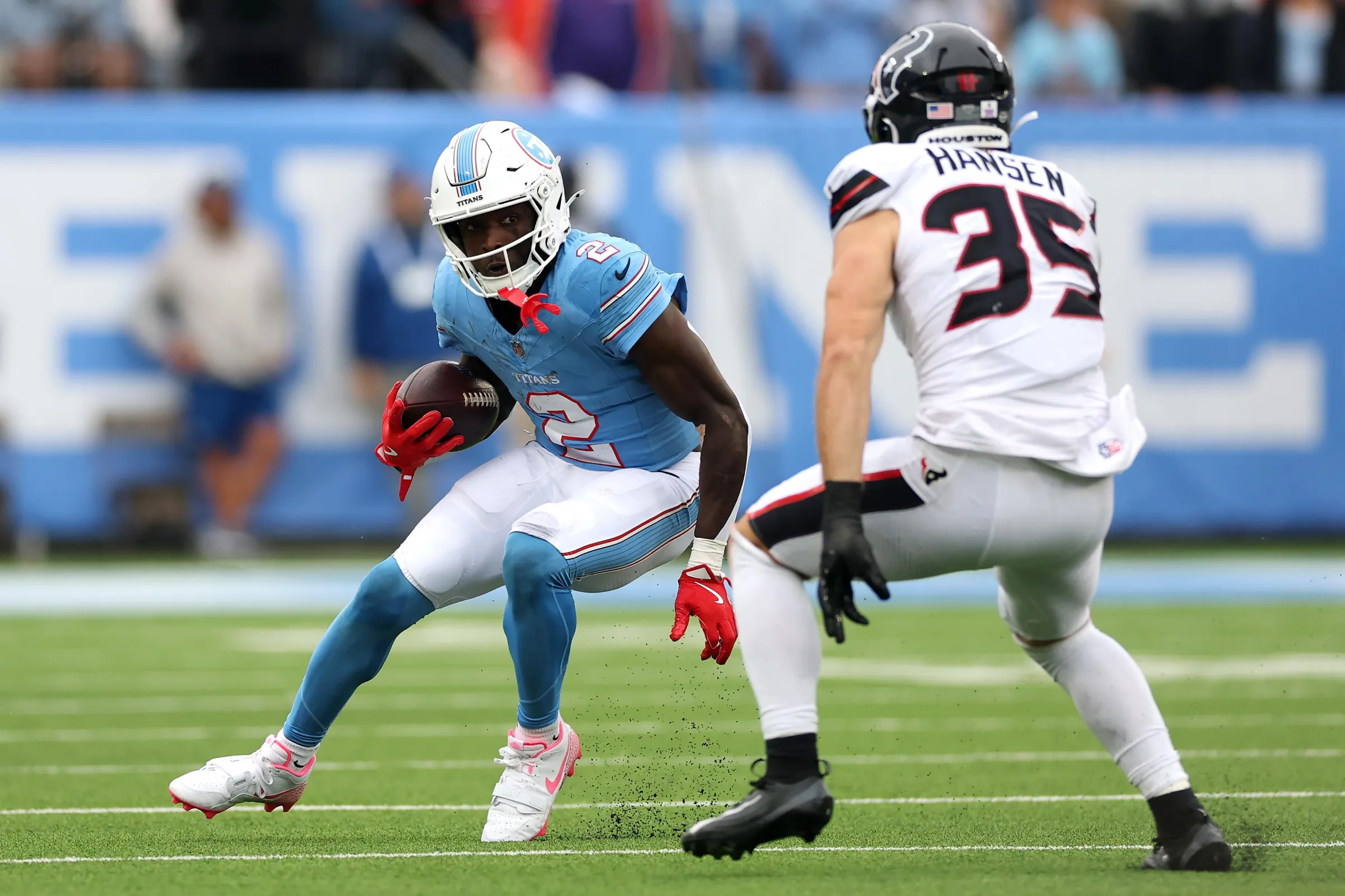 NASHVILLE, TENNESSEE - OCTOBER 11: Tyjae Spears #2 of the Tennessee Titans rushes for yards against Jake Hansen #35 of the Houston Texans during the second quarter of the game at Nissan Stadium on October 11, 2026 in Nashville, Tennessee. (Photo by Andy Lyons/Getty Images)