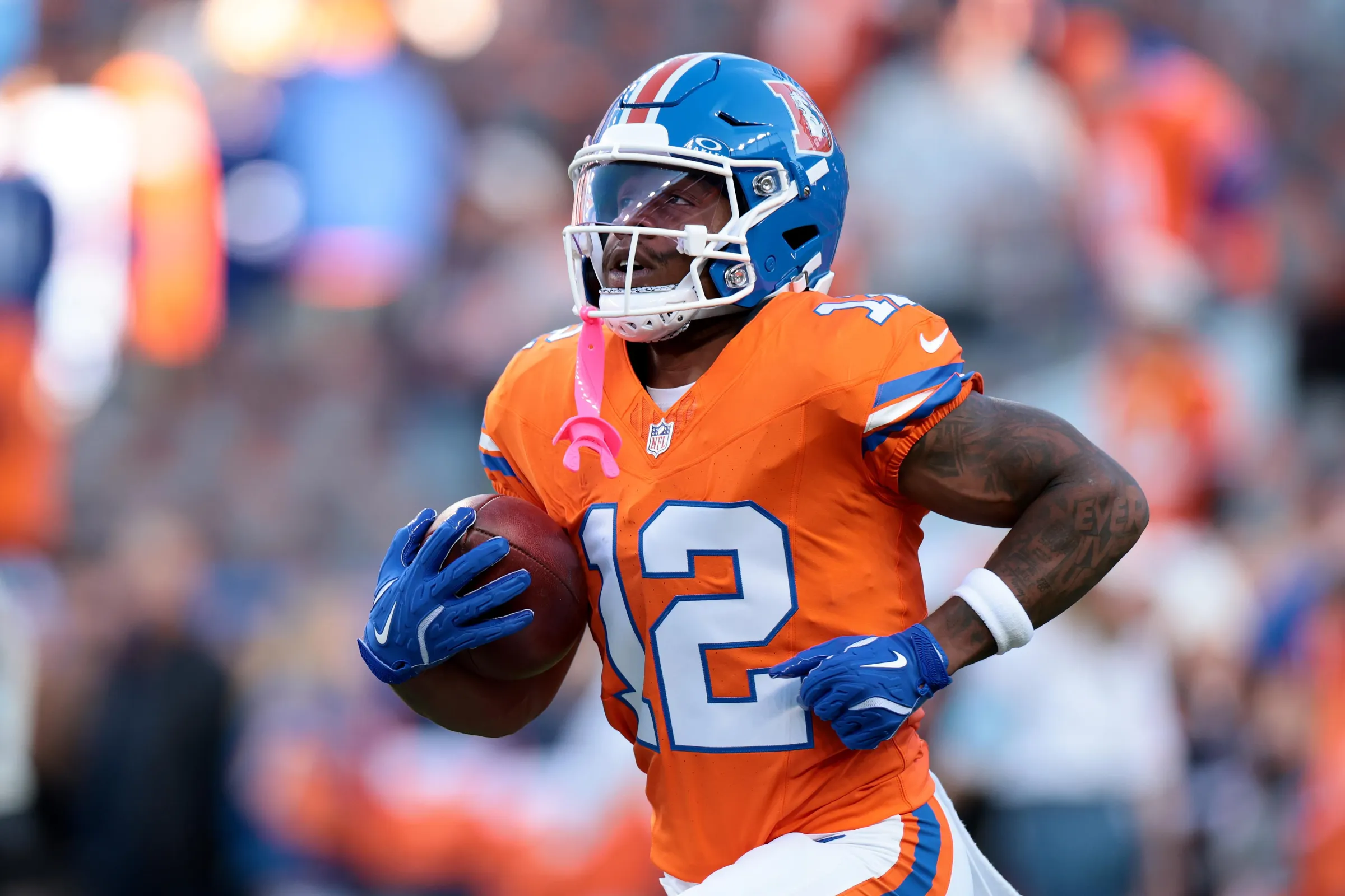 DENVER, COLORADO - OCTOBER 15: RJ Harvey #12 of the Denver Broncos warms up prior to the game against the Seattle Seahawks at Empower Field At Mile High on October 15, 2026 in Denver, Colorado. (Photo by Andrew Wevers/Getty Images)