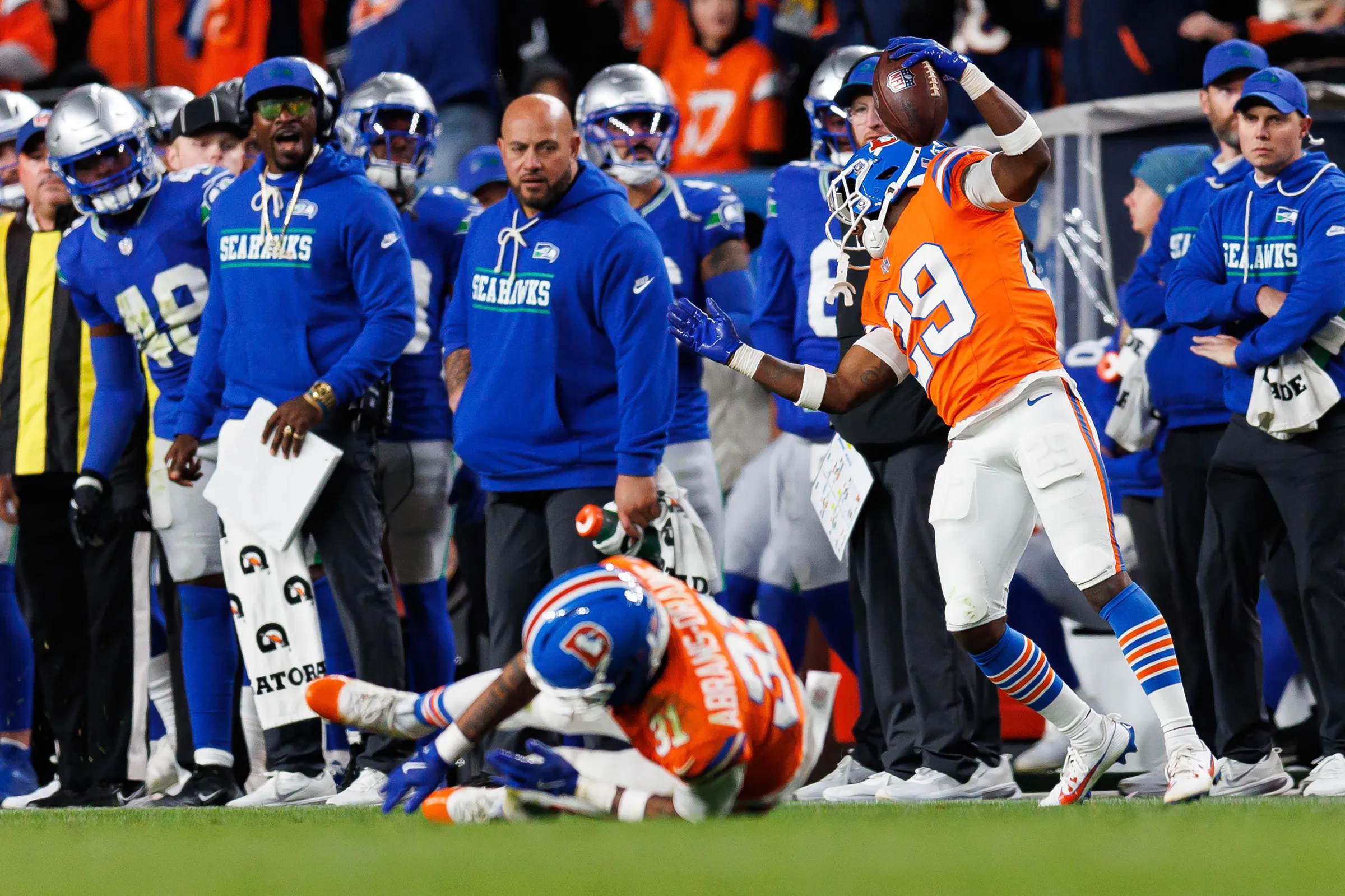 DENVER, COLORADO - OCTOBER 15: Ja’Quan McMillian #29 of the Denver Broncos secures an interception during overtime of an NFL football game against the Seattle Seahawks at Empower Field at Mile High on October 15, 2026 in Denver, Colorado. (Photo by Brooke Sutton/Getty Images)