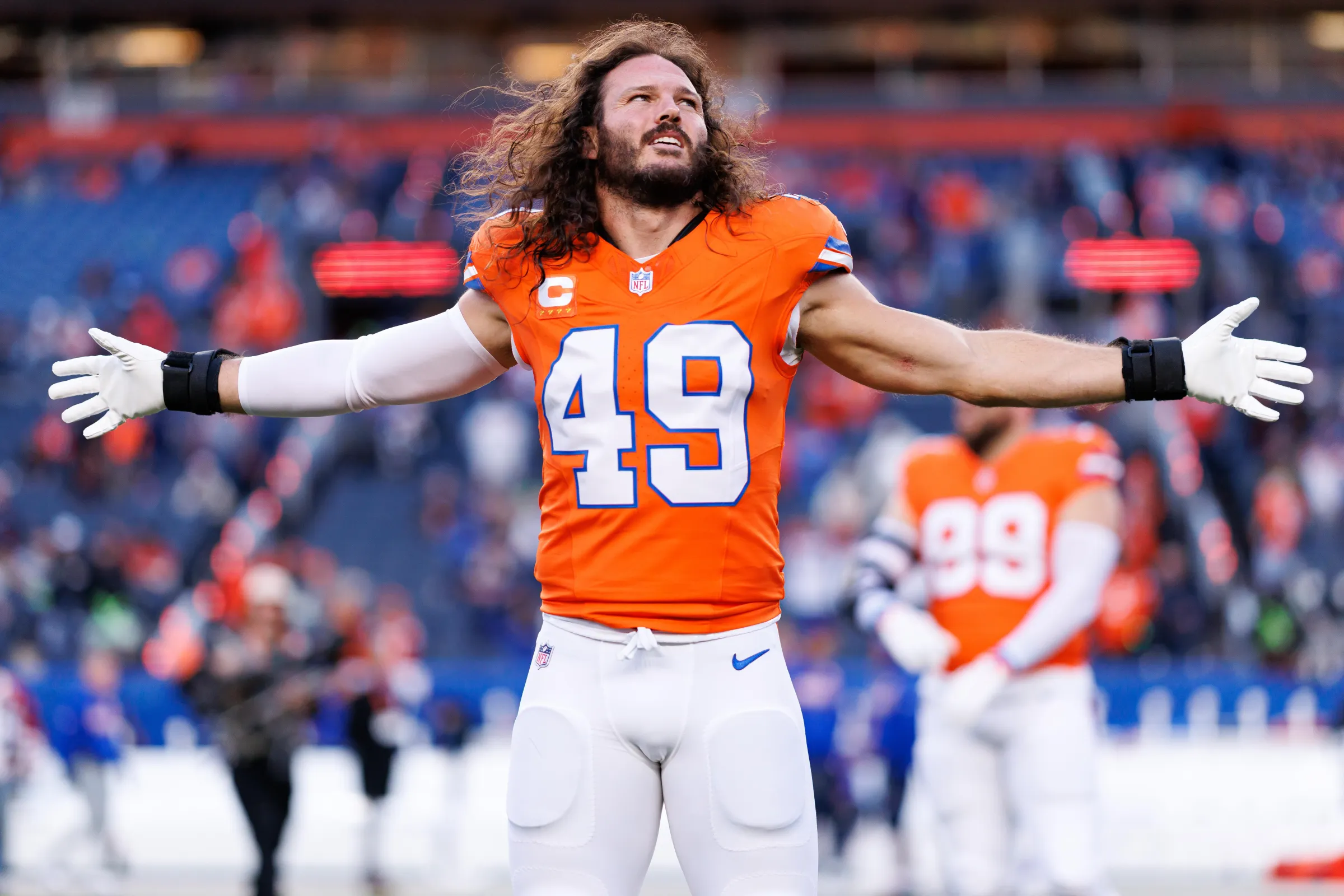 DENVER, COLORADO - OCTOBER 15: Alex Singleton #49 of the Denver Broncos stretches on the field prior to an NFL football game against the Seattle Seahawks at Empower Field at Mile High on October 15, 2026 in Denver, Colorado. (Photo by Brooke Sutton/Getty Images)